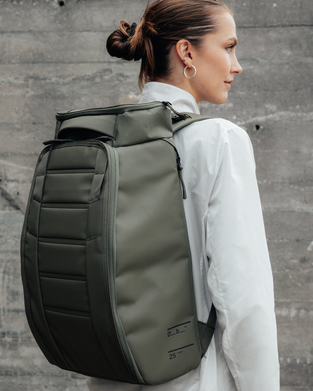 Moss Green_on person_ Hugger 25L.jpg